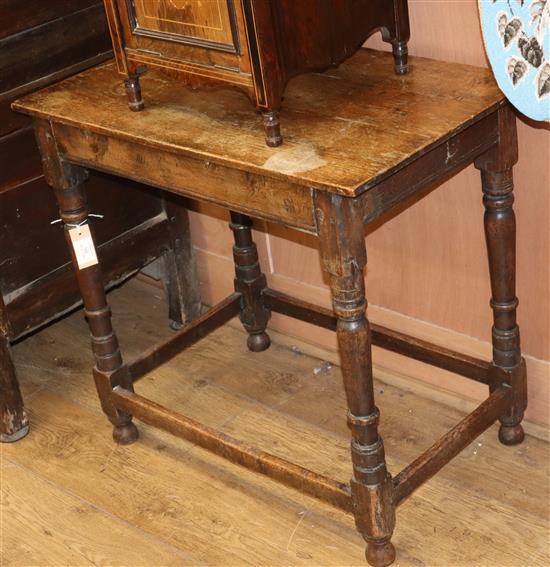 A 17th century oak side table W.74cm